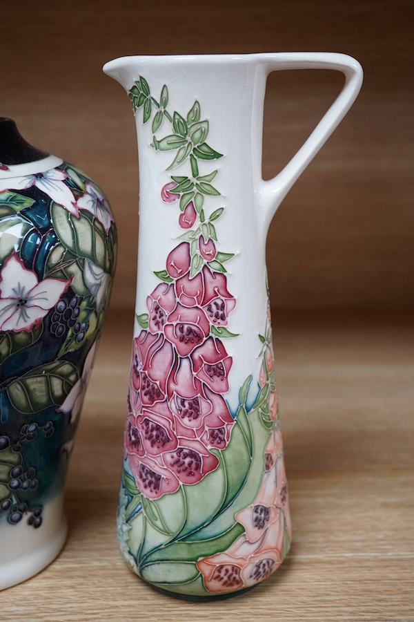 A Moorcroft ‘Nostalgia’ pattern vase together with a similar ‘Foxglove’ pattern ewer, 24.5cm. Condition - good, some crazing